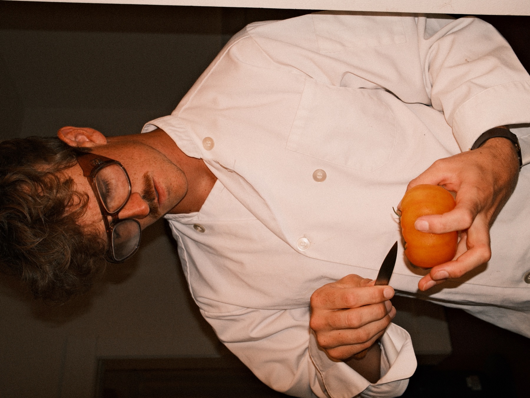 Chef Zack Senac cutting a tomato