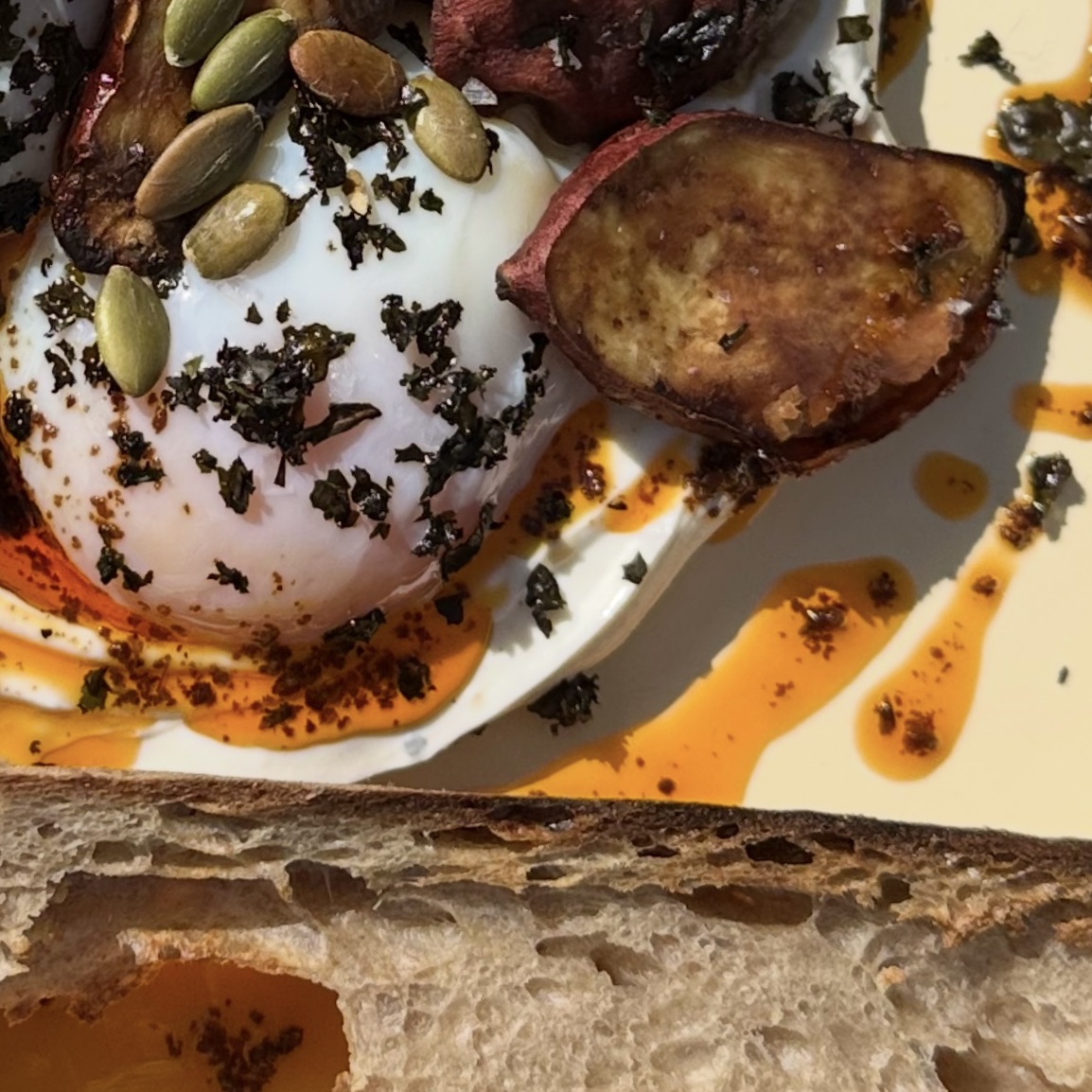 Soft egg, roasted sweet potato, seeds, and sourdough