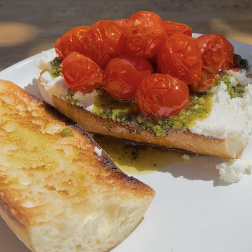 Roasted tomatoes and fresh cheese on sourdough